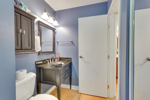 a bathroom with a sink and a toilet at Panama City Beach Bay Point Condo Close to Golf! in Panama City Beach