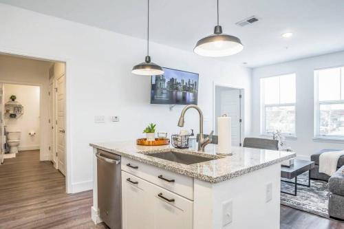 a kitchen with a sink and a counter top at Swanky Atlanta Apartment in Atlanta