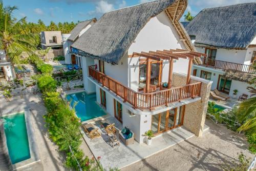 an aerial view of a villa with a swimming pool at Natural Park Villa Resort in Pingwe