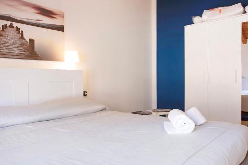 Ένα ή περισσότερα κρεβάτια σε δωμάτιο στο Relax Tra Monti e Laghi