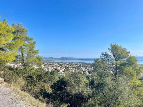 a view of a city from a hill with trees at Mulberry House by the Sea Νέα Μάκρη in Nea Makri