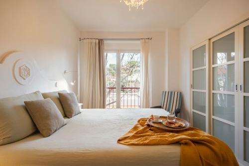 A bed or beds in a room at Corso Emanuele Apartments