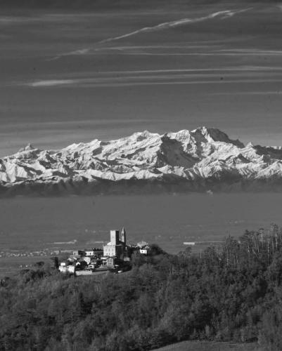 a black and white photo of a city and a mountain at Hotel Milano Pool & Garden in Salice Terme