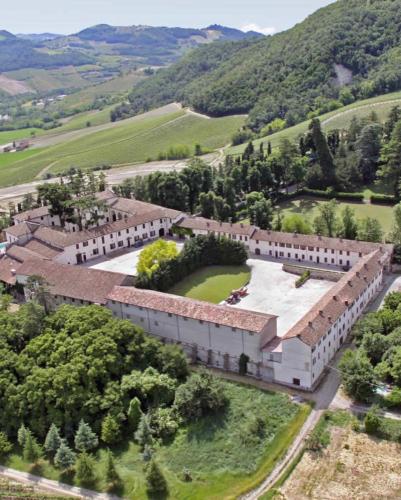 an aerial view of a large building with trees at Hotel Milano Pool & Garden in Salice Terme