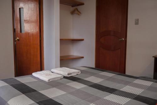 Postel nebo postele na pokoji v ubytování Real House Cusco