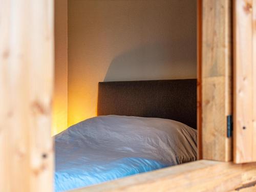 a bedroom with a bed in a room at De Hoeve II in Hulsel