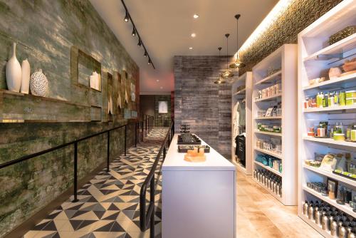a tasting room with a counter and shelves of food at The LINQ Hotel & Casino, A Caesars Destination in Las Vegas