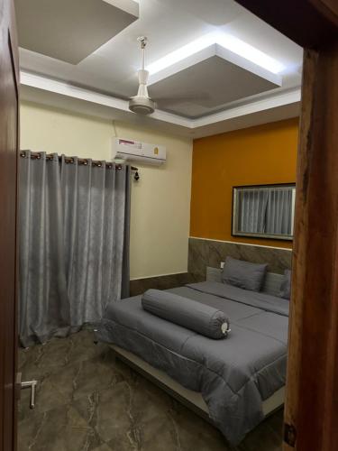 a bedroom with two beds and a ceiling at S & D Guesthouse in Kampot