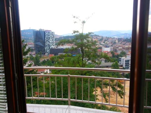 a view of a city from a balcony at Beautiful View Of Sarajevo Center in Sarajevo
