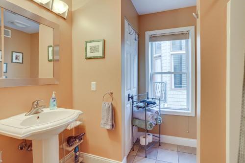a bathroom with a sink and a window at Phoenix Nest South Haven Condo River View! in South Haven