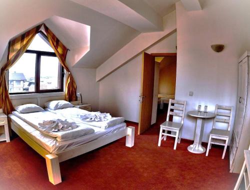 Postel nebo postele na pokoji v ubytování Guest House ANEX