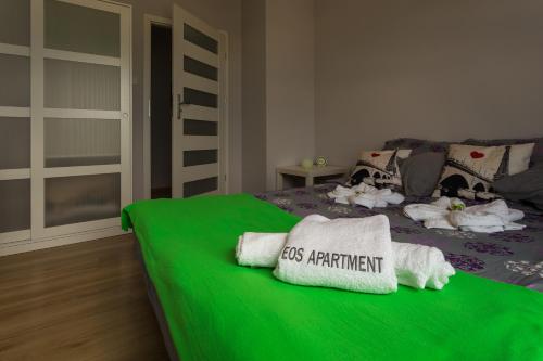 EOS Apartment tesisinde bir odada yatak veya yataklar