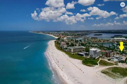 an aerial view of a beach with a yellow arrow at Private Studio 15 -Directly Across from Beach in St Pete Beach