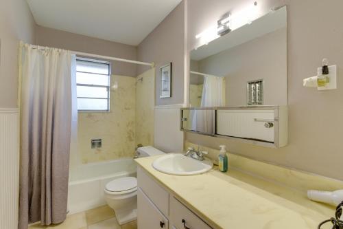 a bathroom with a sink and a toilet and a mirror at Beaumont Rental Home about 2 Mi to Gulf Terrace Park! in Beaumont