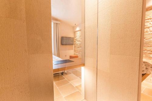 a bedroom with a bed and a desk in a room at Borgo Vinceri in Lucera