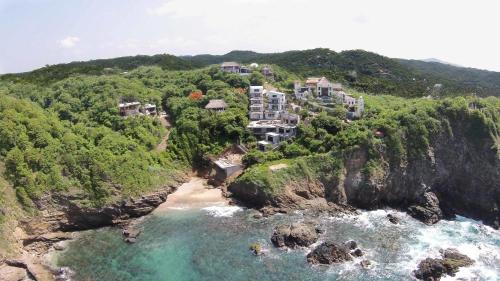 an aerial view of a resort on a cliff at Villa Aikia (Adults Suites A/C) in Zipolite