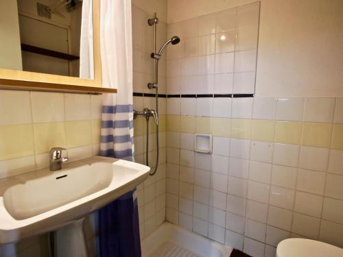 a bathroom with a sink and a shower at Studio Chamrousse, 1 pièce, 4 personnes - FR-1-549-90 in Chamrousse