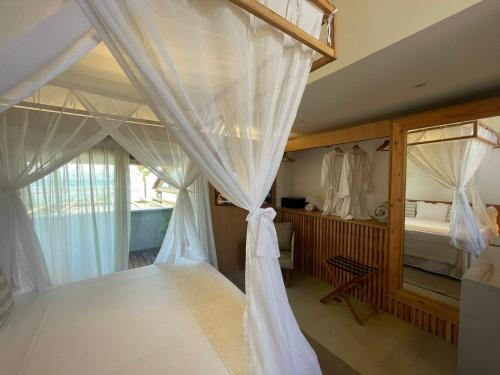 Ένα ή περισσότερα κρεβάτια σε δωμάτιο στο Santa Aldeia Hotel
