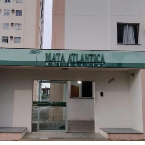 a building with a sign that reads mata art institute at Apartamento Praia do Morro in Guarapari