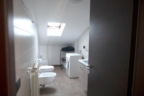 a bathroom with two toilets and a sink at B&B Vista Mare "Terrazzo" in Palmi