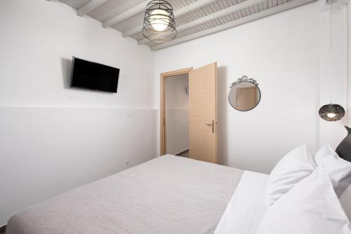Ένα ή περισσότερα κρεβάτια σε δωμάτιο στο Mykonos Town Apartment by Sunshine Place World