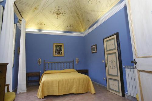Кровать или кровати в номере La Casa di Mamma