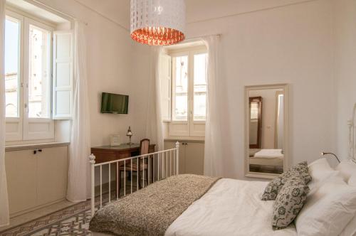 Cama o camas de una habitación en B&B Novecento Siciliano