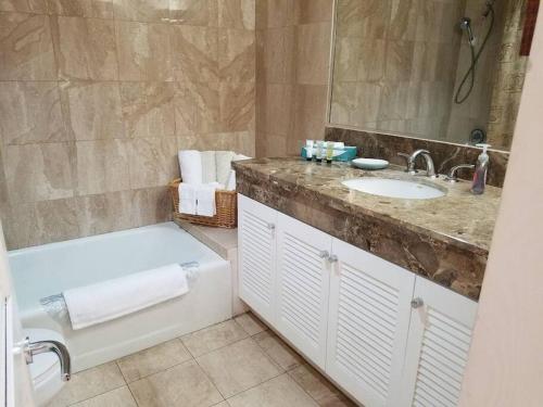 A bathroom at Brooks Beach Vacations Wyndham 4 Star Resort 1805 Waikiki