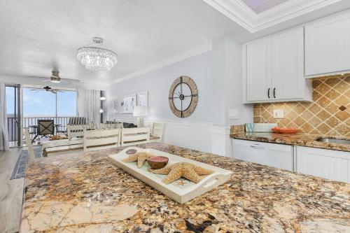 a kitchen with a counter top with two starfish on it at Welcome to Beach Villa's # 405 Vacation Rental - 250 Estero Blvd condo in Fort Myers Beach