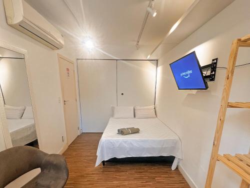 Tempat tidur dalam kamar di Hostel Pluto