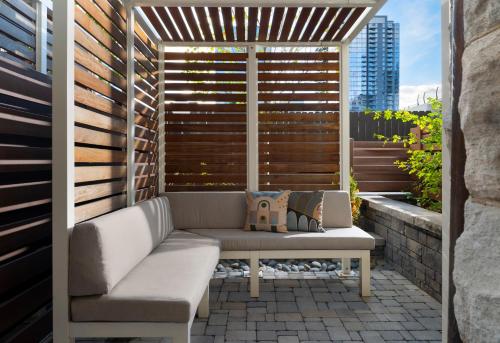 a patio with a couch and a window at The Union Station Nashville Yards, Autograph Collection in Nashville