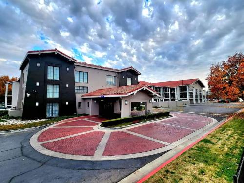 a building with a red rug in the middle of a street at La Quinta Inn by Wyndham Fresno Yosemite in Fresno