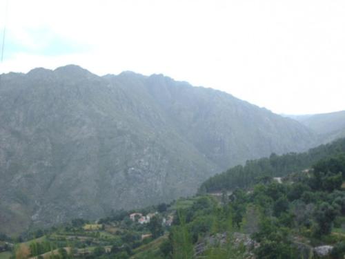 a mountain view of a valley with trees and houses at A casa do pátio in Montalegre