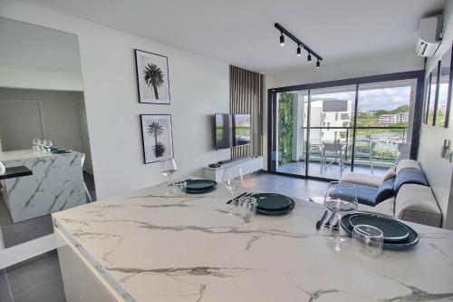 a kitchen with a marble counter top in a room at Appartement Sky Blue in Fort-de-France