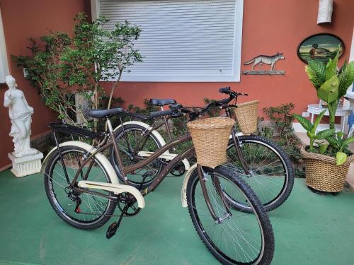 two bikes parked in front of a house at La Belle Provence in Itaipava