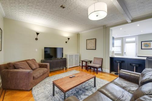 a living room with a couch and a table at 2 Mi to National Mall Modern DC Home in Washington, D.C.