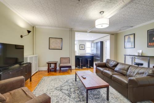 a living room with a couch and a table at 2 Mi to National Mall Modern DC Home in Washington, D.C.
