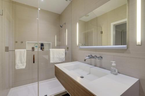 a bathroom with a sink and a shower at 2 Mi to National Mall Modern DC Home in Washington, D.C.
