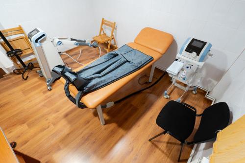 a hospital room with a bed and a machine at Hotel Dorna in Vatra Dornei