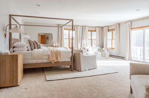 a bedroom with a large bed with a large mirror at Maplewood Manor 8BR, Hot Tub, Gym, Fire Pit in Jewett