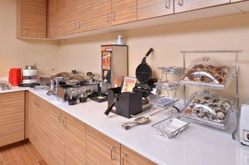 a kitchen with a counter top with some food at TownePlace Suites by Marriott Gillette in Gillette