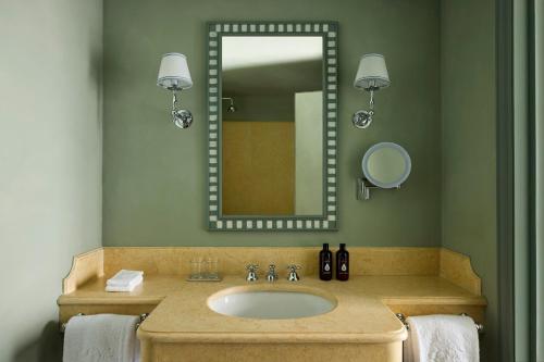 a bathroom with a sink and a mirror at Castello Del Nero - Podere San Filippo in Tavarnelle in Val di Pesa