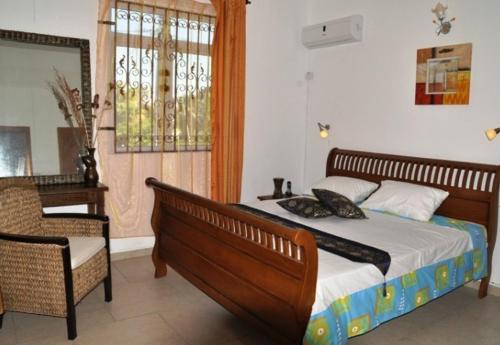 Tempat tidur dalam kamar di Villa Sundara Mauritius