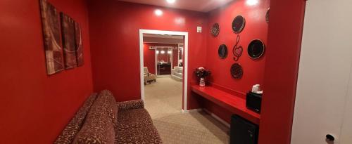 a red room with a red wall at Inn of the Dove - Romantic Luxury Suites with Jacuzzi & Seasonal Fireplace at Harrisburg-Hershey-Philadelphia, PA in Harrisburg