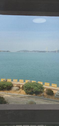 a view of a large body of water with a bridge at SM Resortel in Goheung