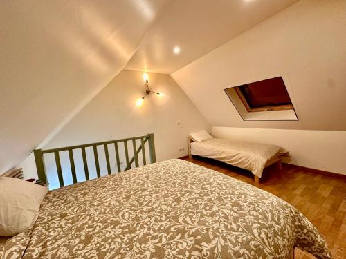 a small bedroom with a bed and a small table at Maison near Disneyland , Paris in Champs-Sur-Marne
