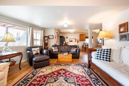 a living room with a couch and a table at Meandering Moose Apartment in Black Hawk