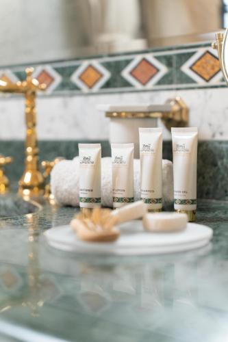 a group of four products sitting on a counter at Hotel Villa La Bollina in Serravalle Scrivia
