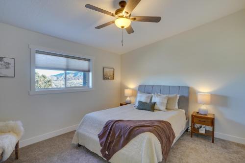a bedroom with a bed and a ceiling fan at Cedar City Home with Mountain Views and Game Room! in Cedar City