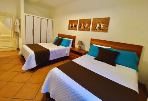 Letto o letti in una camera di Torre Mar Galapagos Boutique Suites